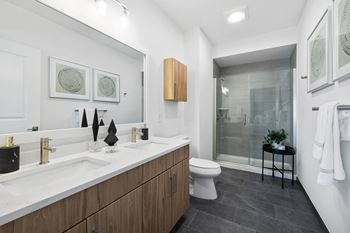 a bathroom with a sink and a toilet and a shower at Stonehill at West Orange, New Jersey